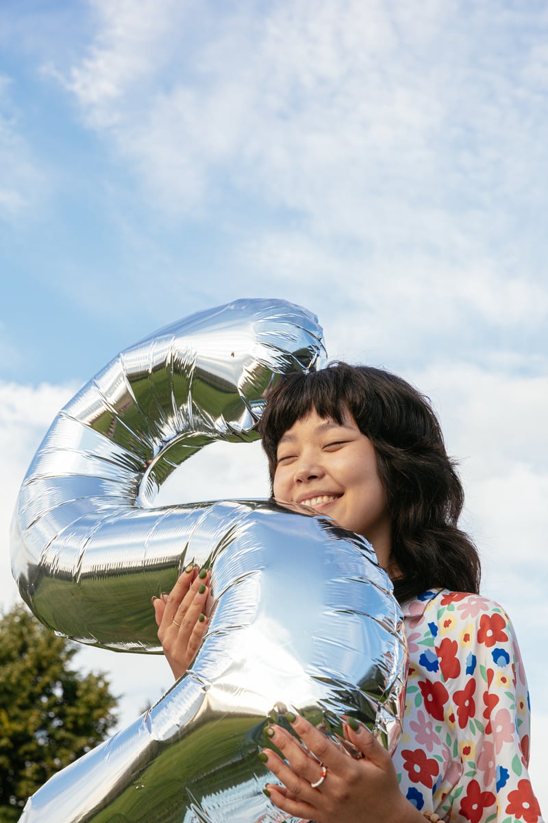 Portrait of Woman with Number Balloon